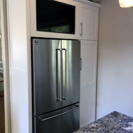 Custom Motorized TV above Fridge